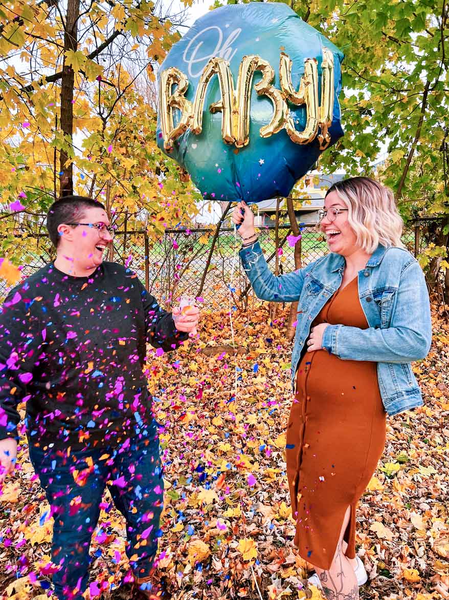 Celebratory Mosie Baby announcement with confetti, balloons and mamas-to-be