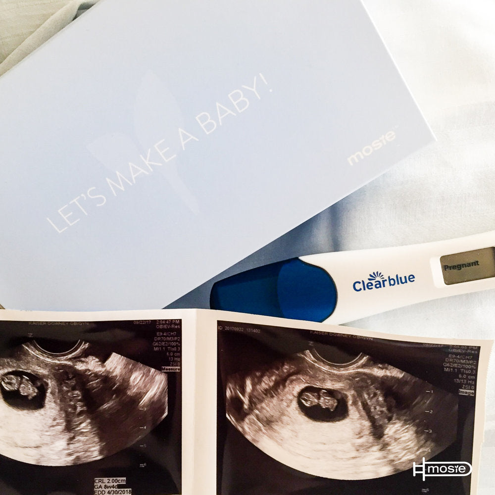 Positive pregnancy test, sonogram, and a mosie baby box