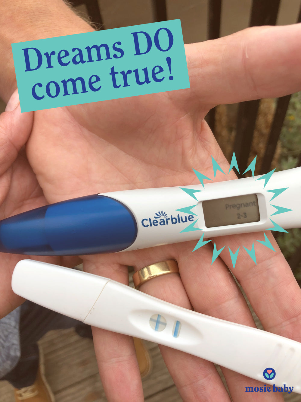 a man holding two positive pregnancy tests