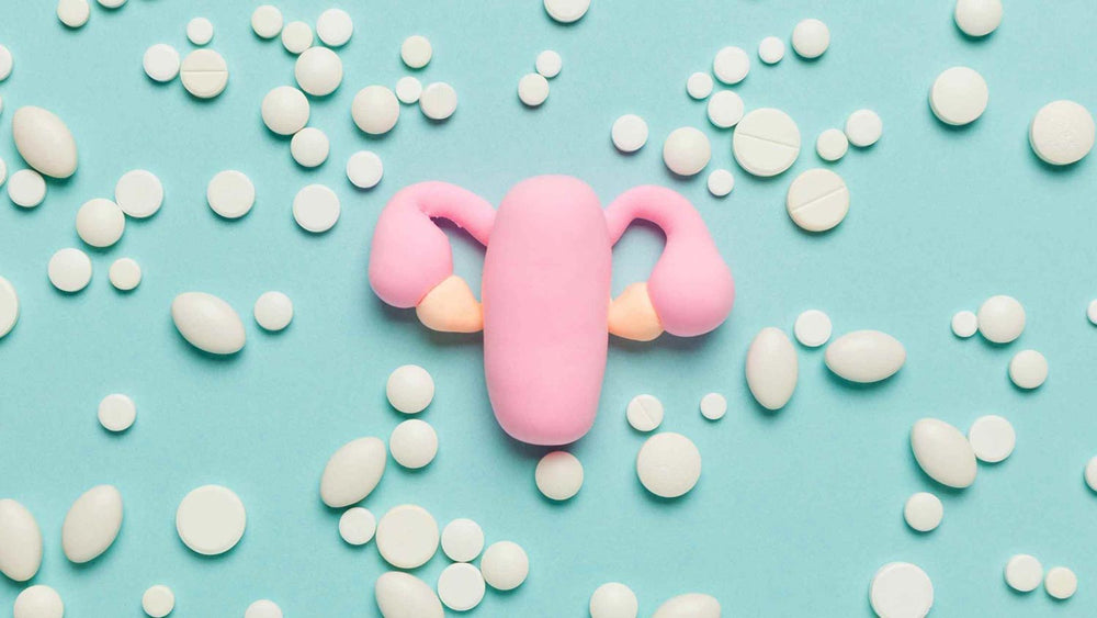 Mosie Baby article image, Letrozole for fertility and getting pregnant. Shows a pink toy uterus and white pills
