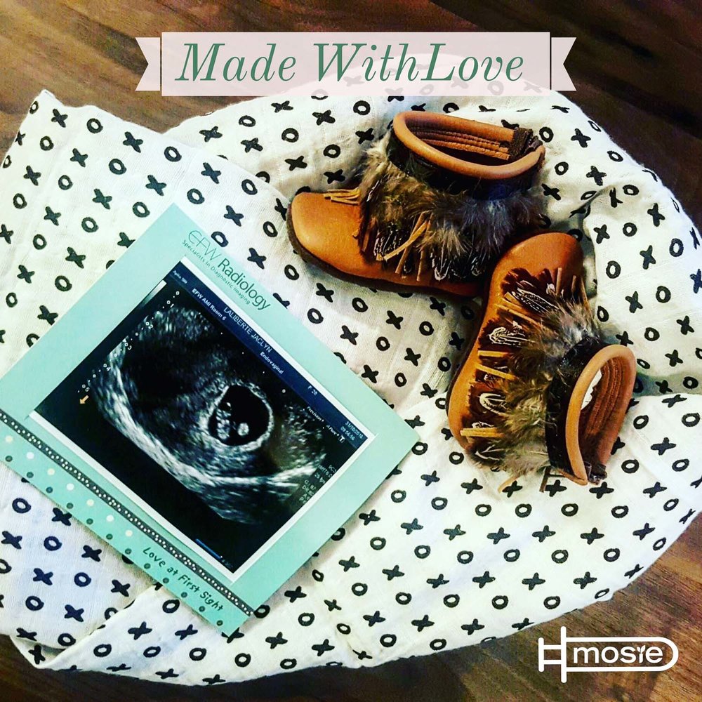 sonogram, baby blanket, and baby boots of a mosie baby